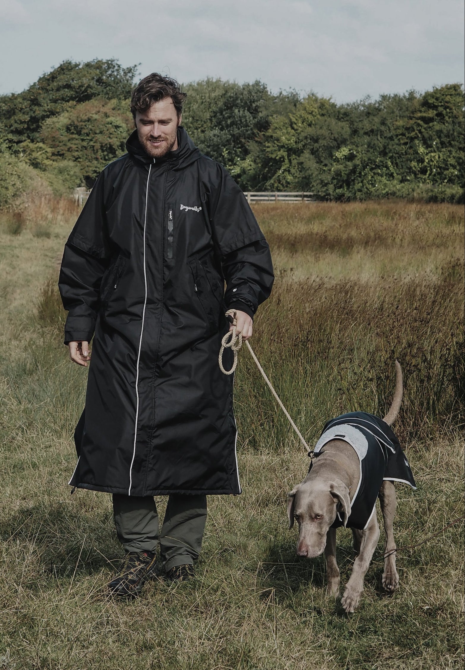 Drywalks Waterproof Dog Coat in black man taking dog for a walk