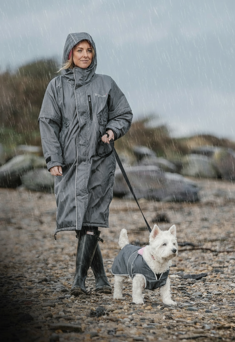 Drywalks Waterproof Dog Coat in charcoal/pink woman walking dog on beach