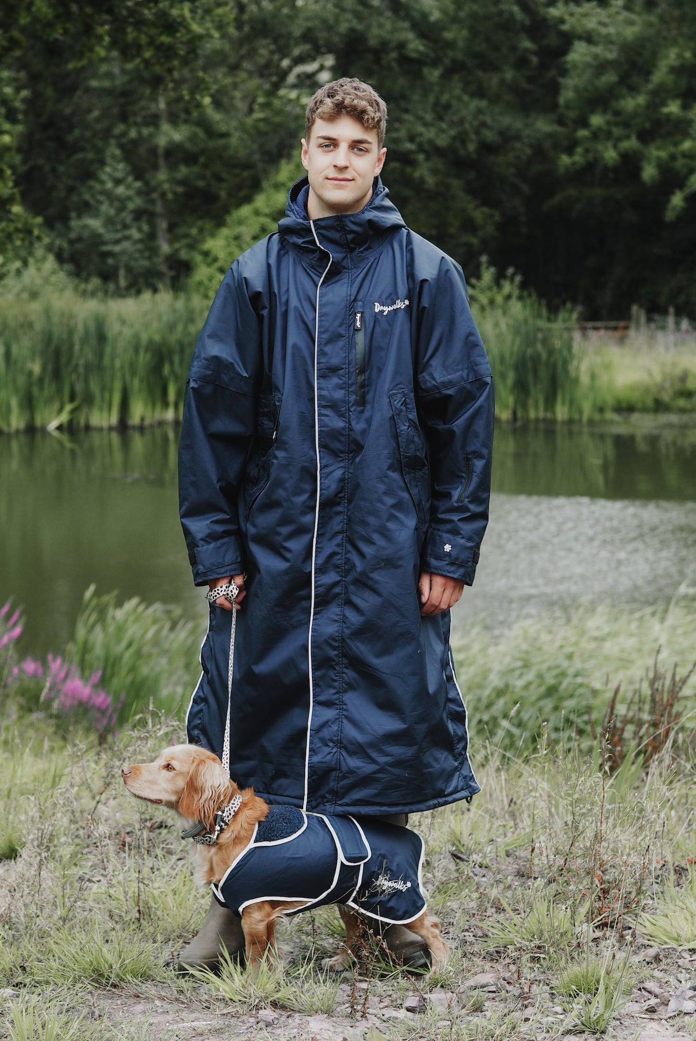 Drywalks Waterproof Dog Coat in navy man in matching coat walking dog