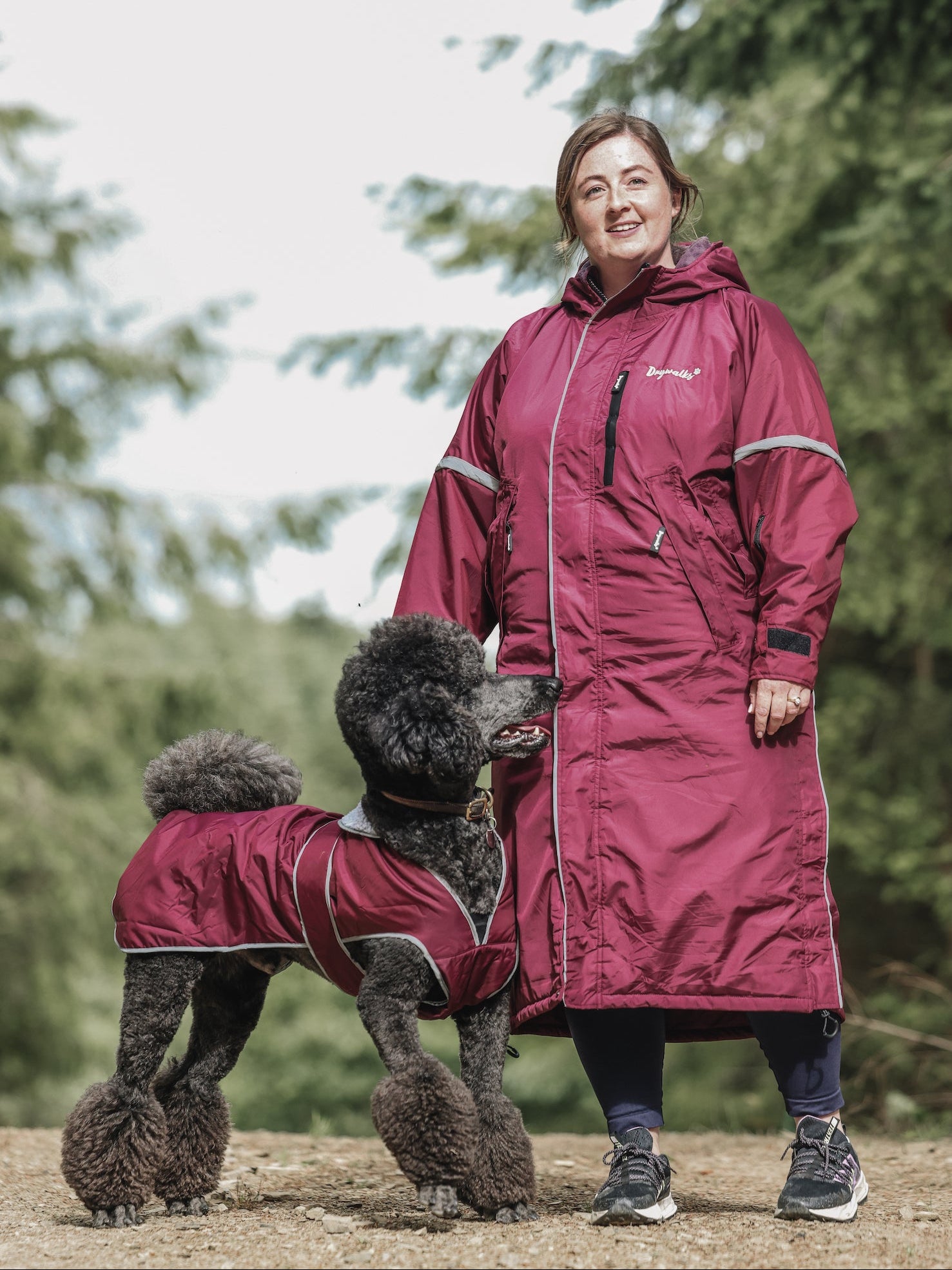 Drywalks Waterproof Dog Coat in plum woman walking dog in matching coat