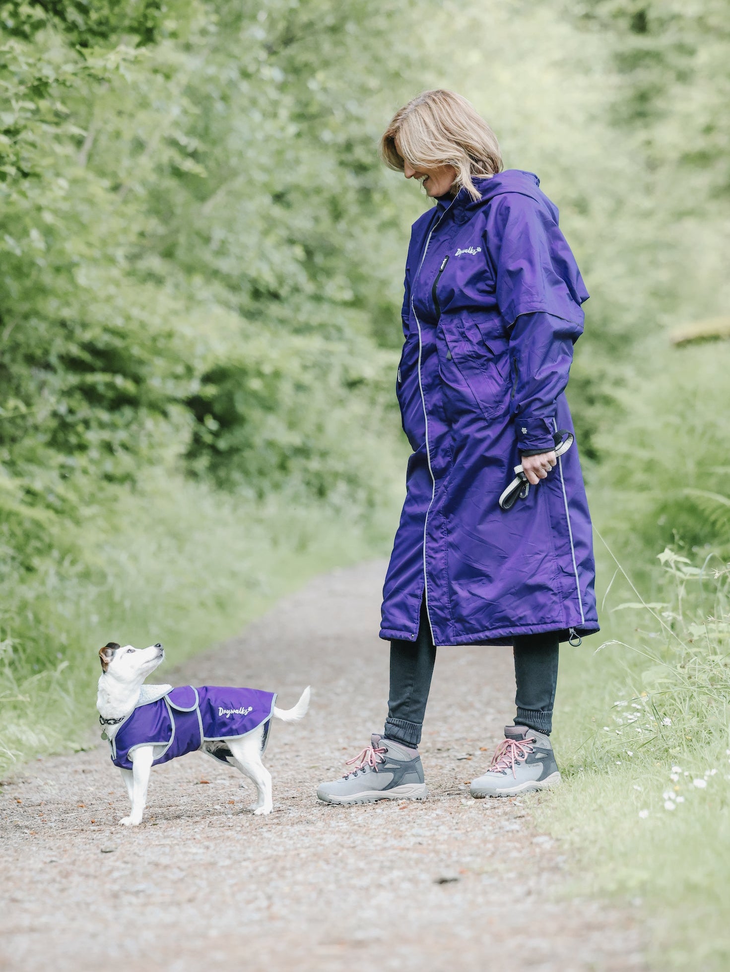 Drywalks Waterproof Dog Coat in purple woman in matching coat walking dog