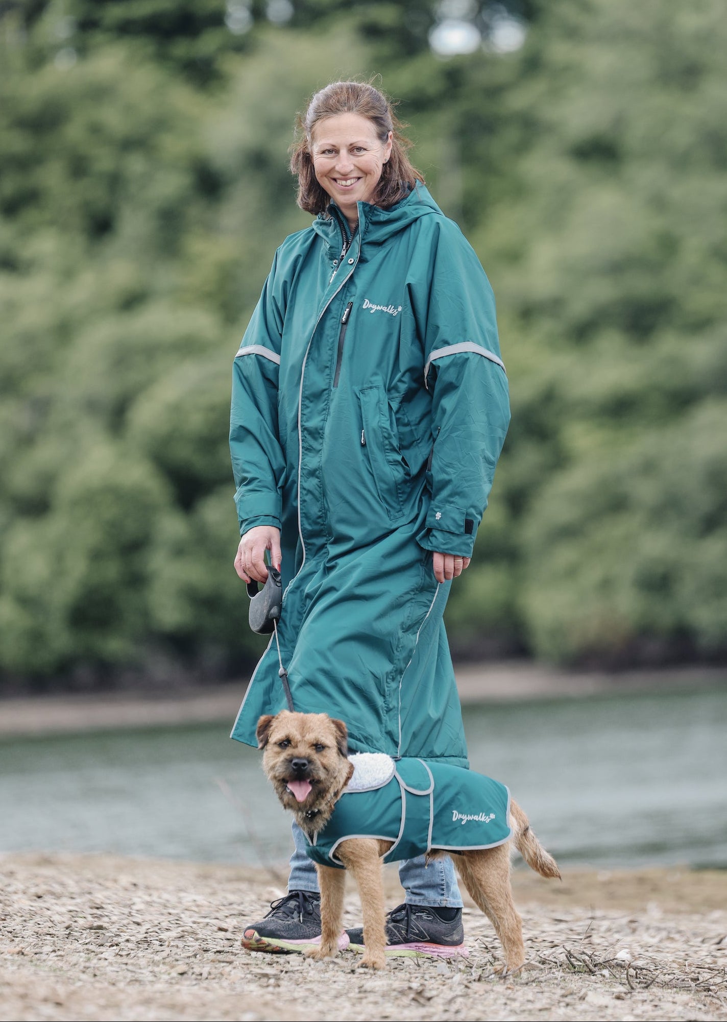 Drywalks Waterproof Dog Coat in teal woman in matching coat on walk
