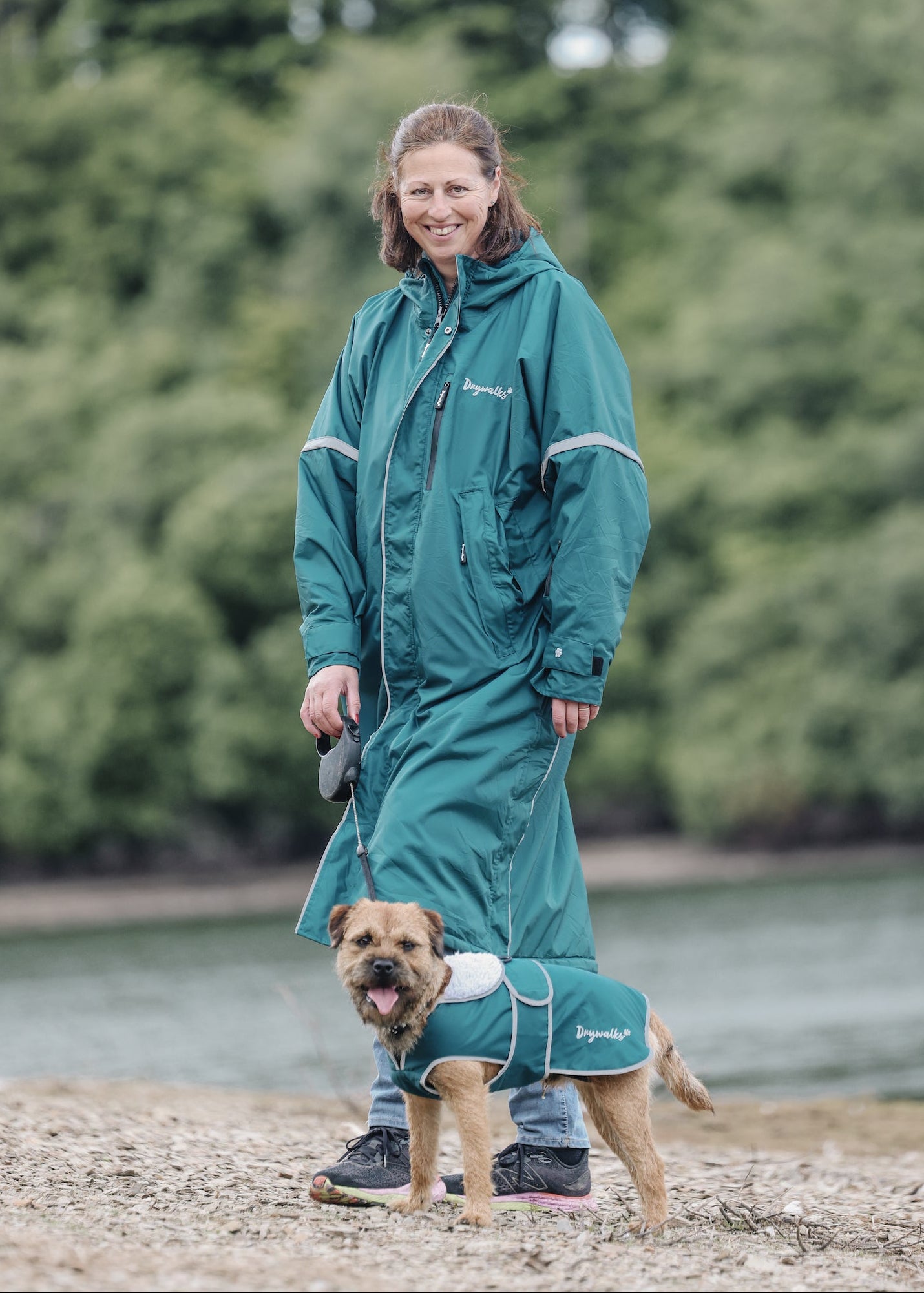 Drywalks Waterproof Dog Coat in teal woman in matching coat on walk