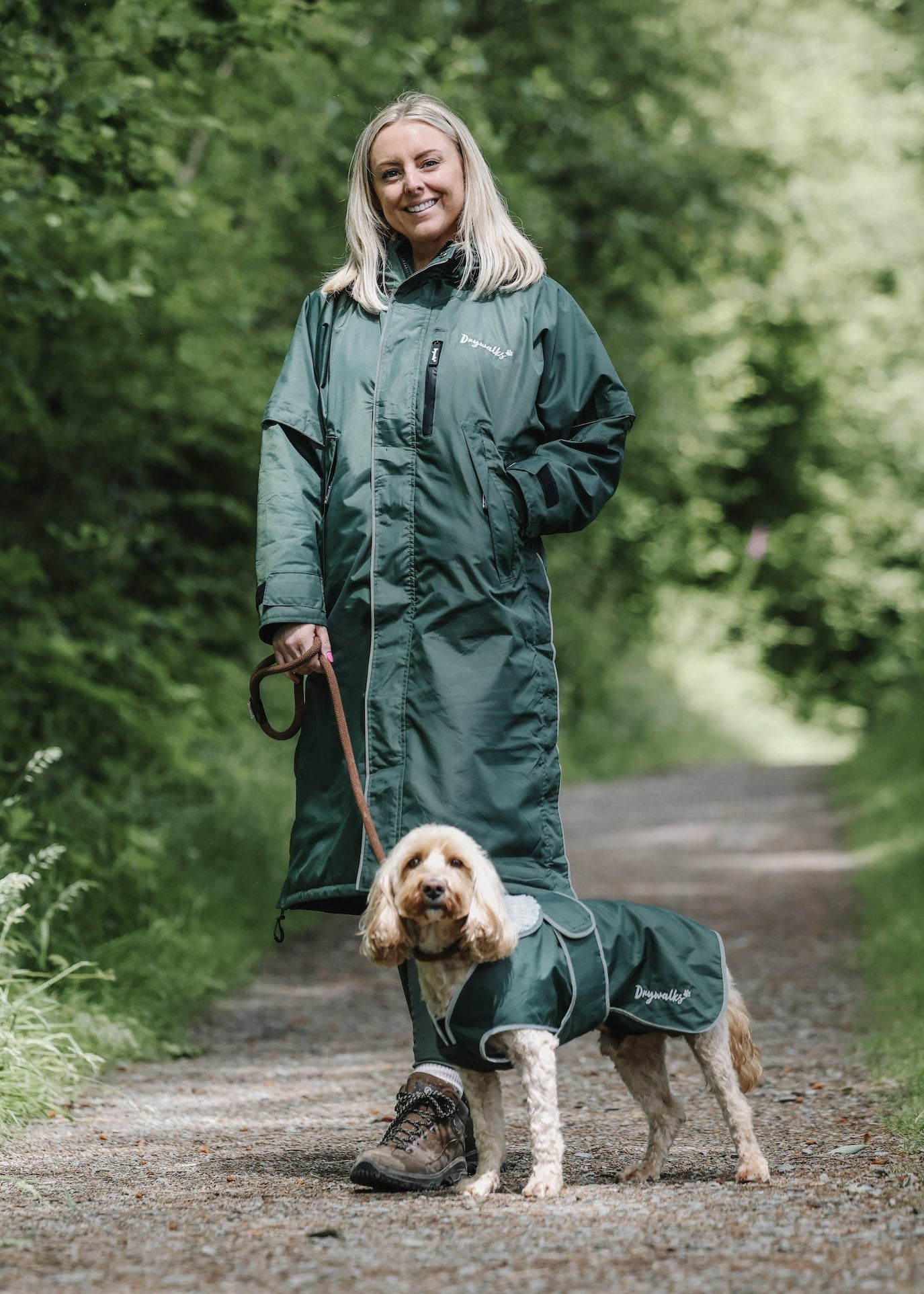 Drywalks Waterproof Dog Coat in black forest green woman matching with dog on walk