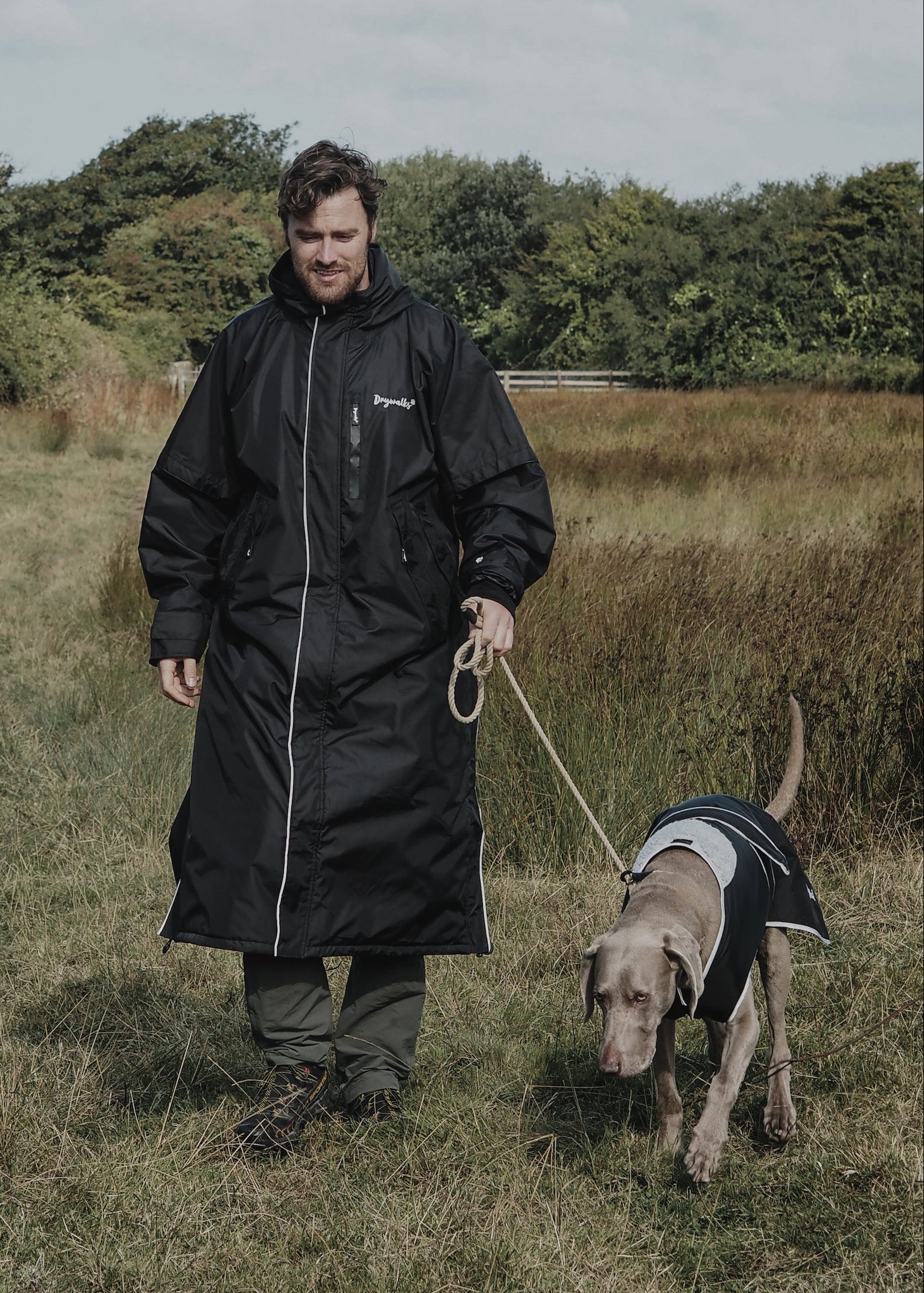 Drywalks Waterproof Dog Coat in black man taking dog for a walk