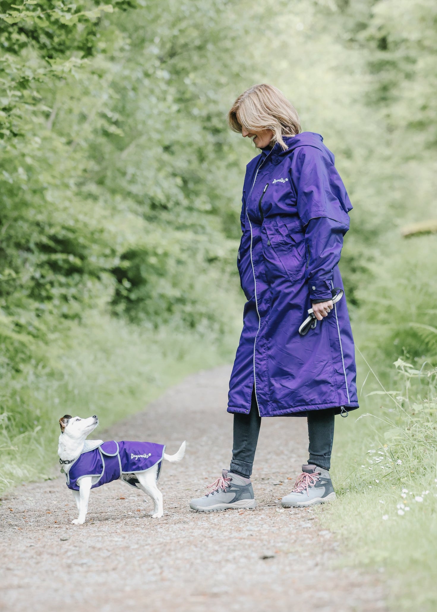Drywalks Waterproof Dog Coat in purple woman in matching coat walking dog