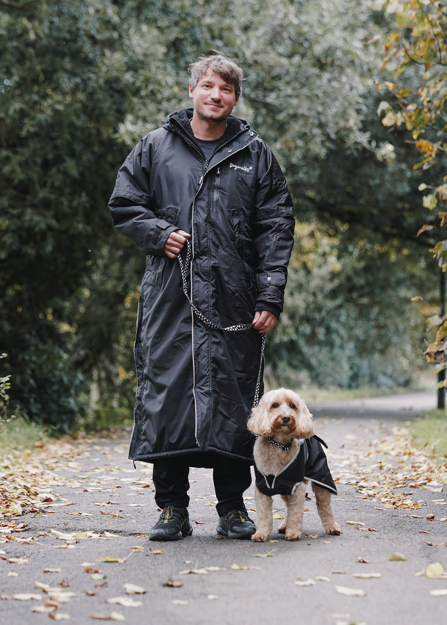 Drywalks Winter Walker Waterproof Dog Walking Coat in black man on walk with matching dog coat