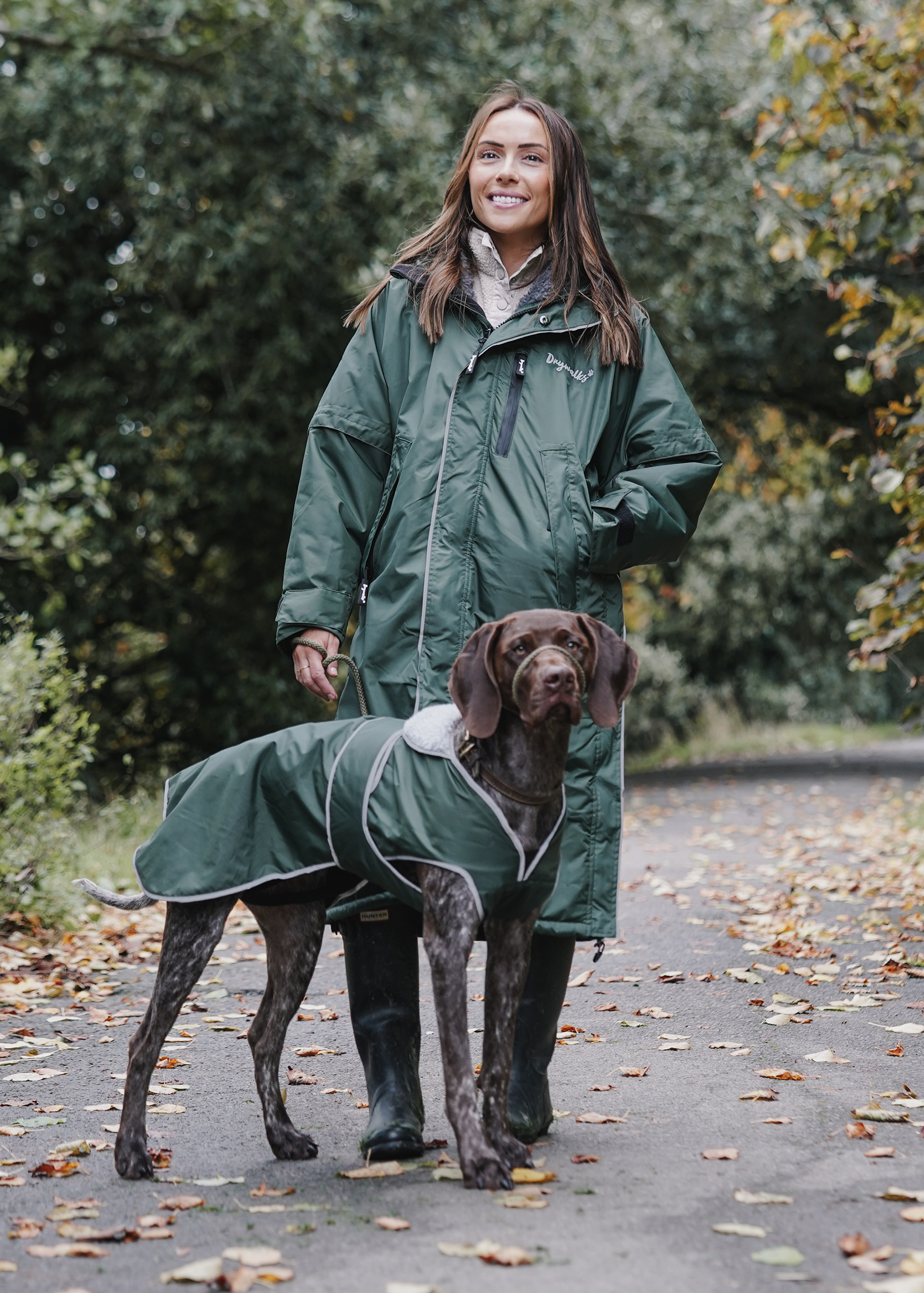 Drywalks Winter Walker Waterproof Dog Walking Coat in black forest green woman on walk with dog in matching coat
