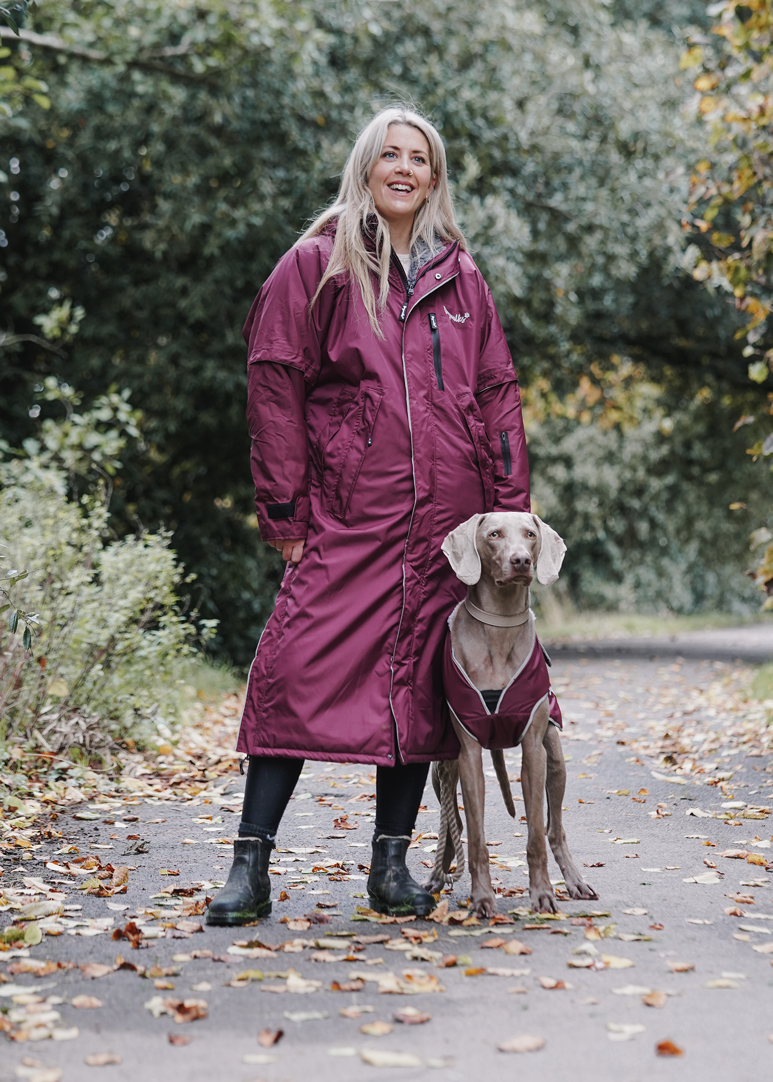 Drywalks Winter Walker Waterproof Dog Walking Coat in plum woman and dog on walk in matching coats